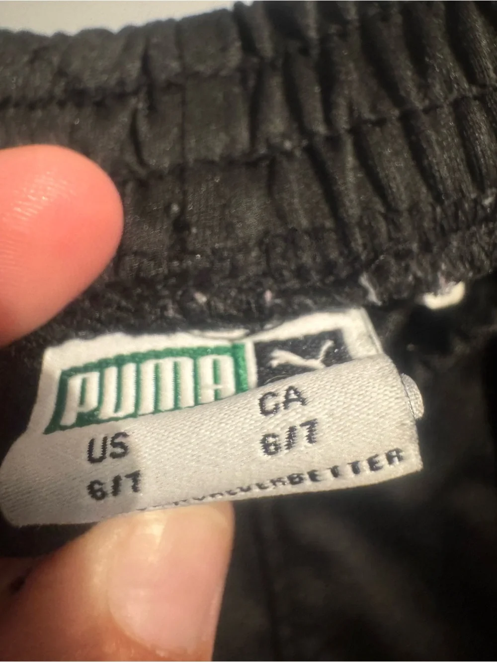 Puma Black Shorts with White Label and Green Logo